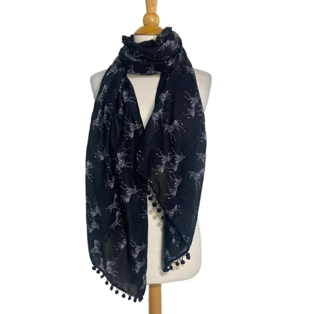 Black & white zebra print scarf with pom pom‎ trim
